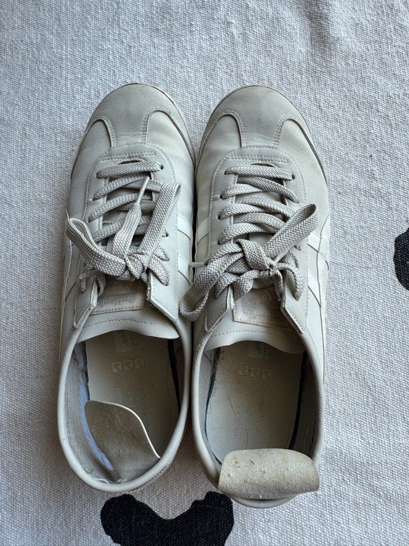 Onitsuka Tiger Mexico 66 Sneakers - White (Category: Sneakers) located in Singapore. Submitted by rollingsmiley (Listing ID 1401584773, Image 2). Description: Used Onitsuka Tiger Mexico 66 sneakers in white. Visible wear on the soles and some discoloration. The insoles show some wear and tear. Size US6 EUR39 Self pick up at 448873.