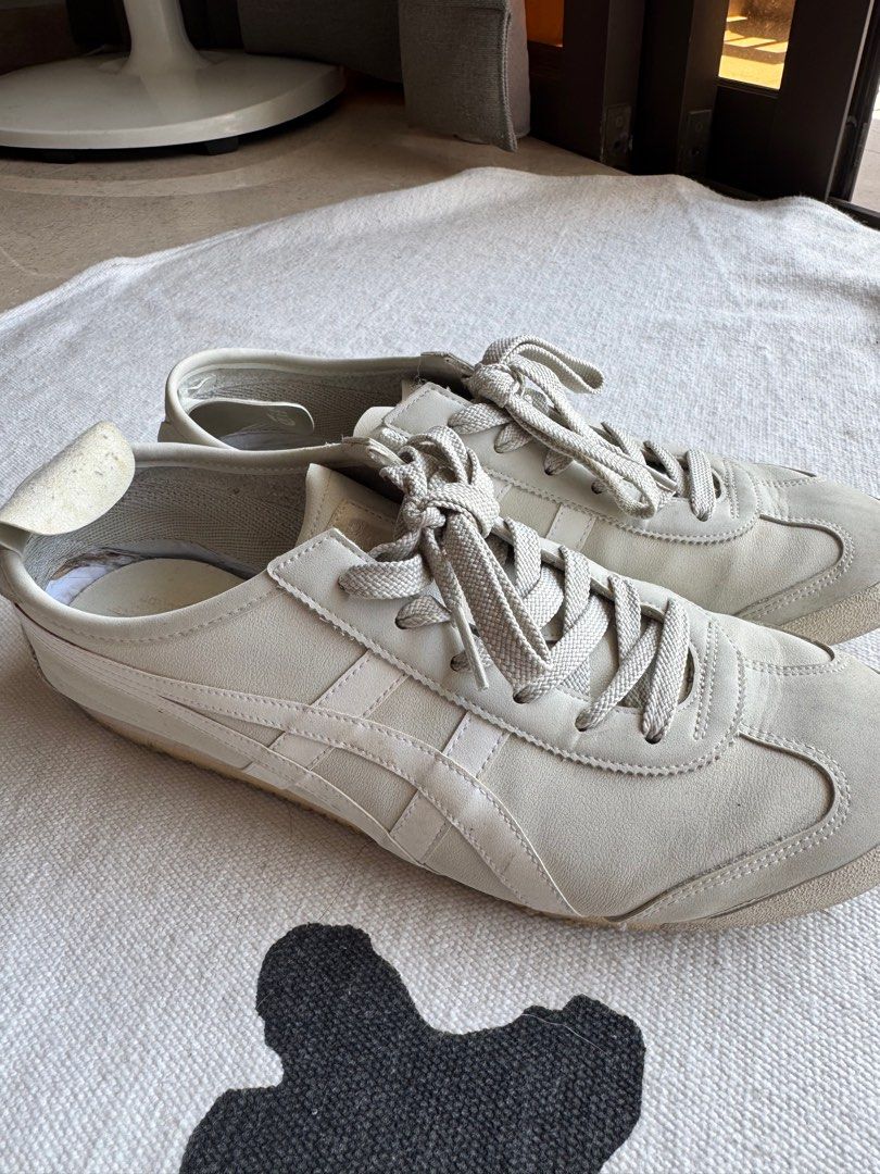 Onitsuka Tiger Mexico 66 Sneakers - White (Category: Sneakers) located in Singapore. Submitted by rollingsmiley (Listing ID 1401584773, Image 3). Description: Used Onitsuka Tiger Mexico 66 sneakers in white. Visible wear on the soles and some discoloration. The insoles show some wear and tear. Size US6 EUR39 Self pick up at 448873.