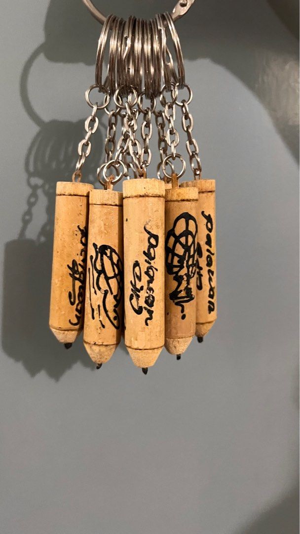 Palawan Souvenir Keychains 9pcs (Category: Vintage Collectibles) located in Manila. Submitted by decluttify (Listing ID 1401698583, Image 1). Description: 9pcs of Palawan Souvenir Keychains - Set of miniature pencil keychains - Each keychain has a unique design and text - Designs may represent different symbols for Palawan - Attached to silver keyrings with small chains - Made of wood with black and green ink details #pasalubong #gift #freebie.