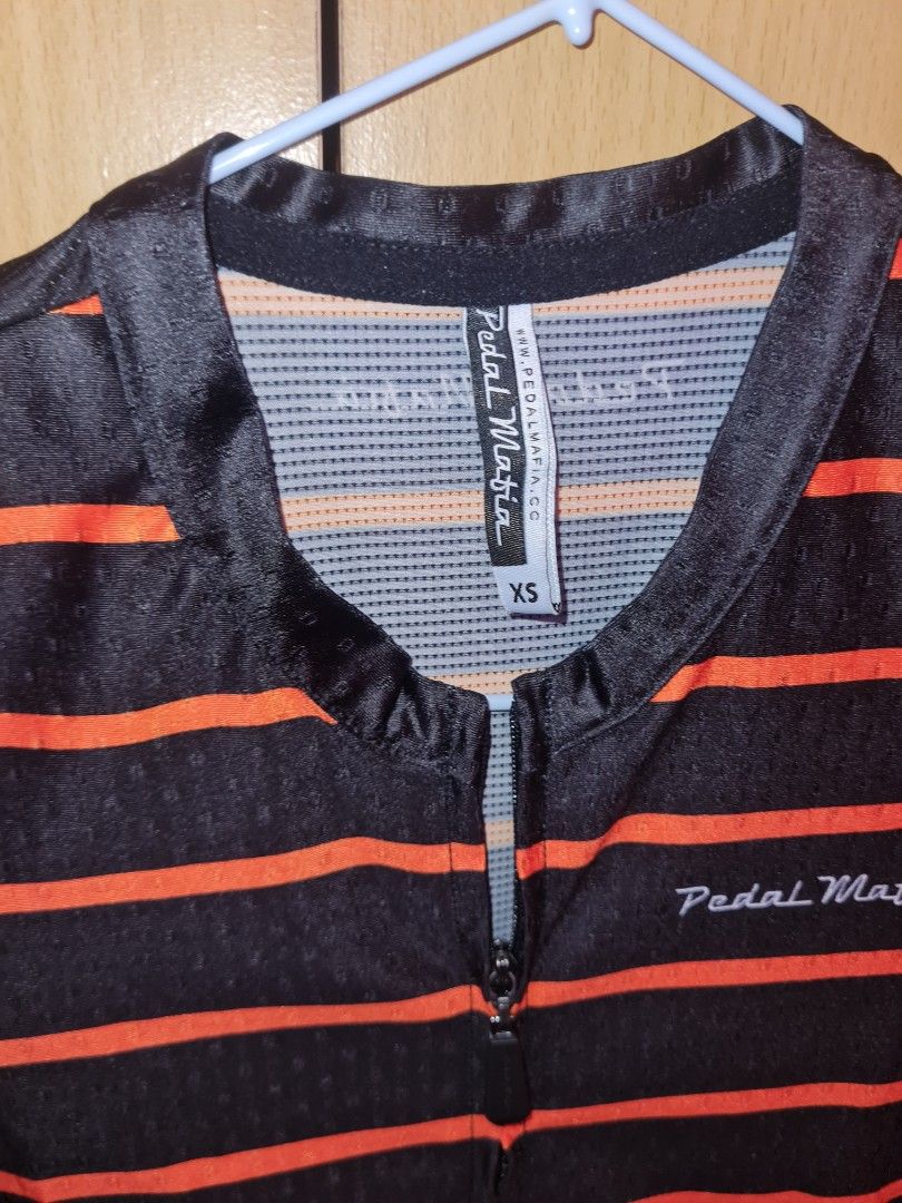 Pedal Mafia Jersey (Category: Activewear) located in Quezon City. Submitted by raymorph (Listing ID 1401596983, Image 3). Description: Black with Orange Stripes. Size XS. Feels like size small. Can pass as new. No issues. RFS. Too many jerseys Color may be subject to change under different lighting conditions..