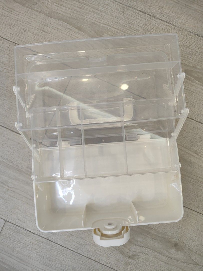 Plastic Storage Box with Handle (Category: Storage Boxes & Baskets) located in Caloocan City. Submitted by cssasot (Listing ID 1401703078, Image 2). Description: Plastic storage box features a clear lid and a white handle for easy carrying. It has multiple compartments for organizing items. The box has a secure latch to keep contents safe. It is ideal for storing small items, crafts, or other essentials. The box is clean and ready for use..