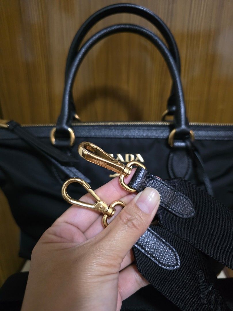 Prada Black Nylon Handbag (Category: Luxury Bags & Wallets) located in Cainta. Submitted by annavm (Listing ID 1401544619, Image 3). Description: Personal owned bag. Bought 2022 with dustbag, care card, authenticity card, rfid You may request additional pictures.