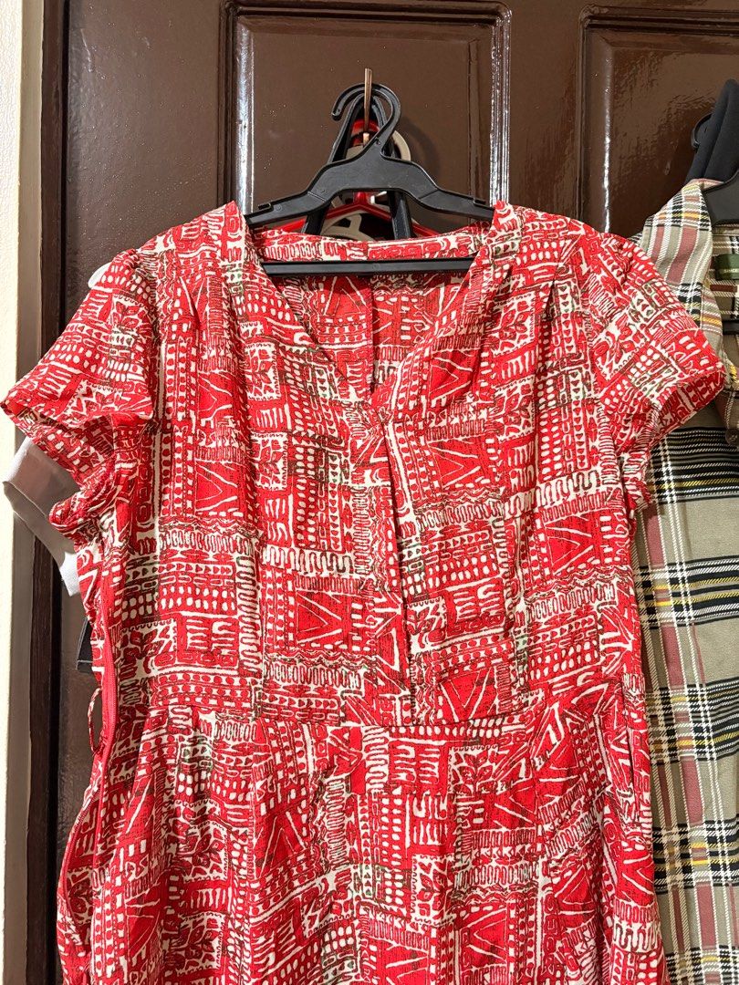 Red Printed Dress (Category: Dresses) located in Manila. Submitted by orion_declutter (Listing ID 1401654184, Image 2). Description: - Red dress with a unique white print - Short sleeves and V-neckline - Side zipper closure - Lightweight fabric - Fitted bodice - Slightly flared skirt - Includes pockets - Ideal for warm weather.
