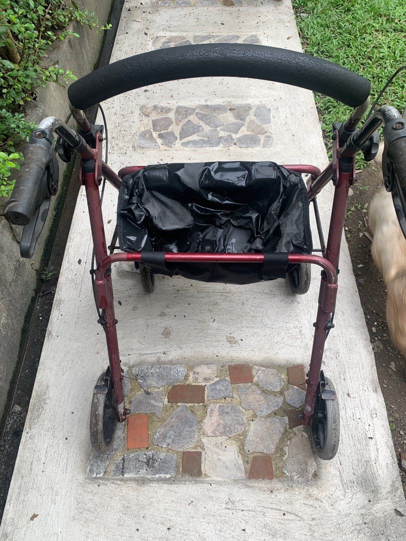 Rolling Walker for adults medical (Category: Medical Supplies & Tools) located in Quezon City. Submitted by sojisup (Listing ID 1401548451, Image 3). Description: - Burgundy frame - Black padded handle - Black storage basket - Four wheels for easy mobility - Handles with brakes - Good working condition but some signs of aging. Selling as is. Thank you .