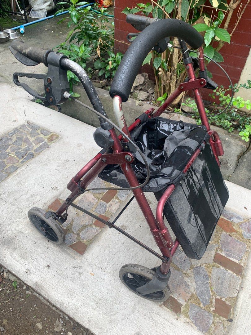 Rolling Walker for adults medical (Category: Medical Supplies & Tools) located in Quezon City. Submitted by sojisup (Listing ID 1401548451, Image 2). Description: - Burgundy frame - Black padded handle - Black storage basket - Four wheels for easy mobility - Handles with brakes - Good working condition but some signs of aging. Selling as is. Thank you .