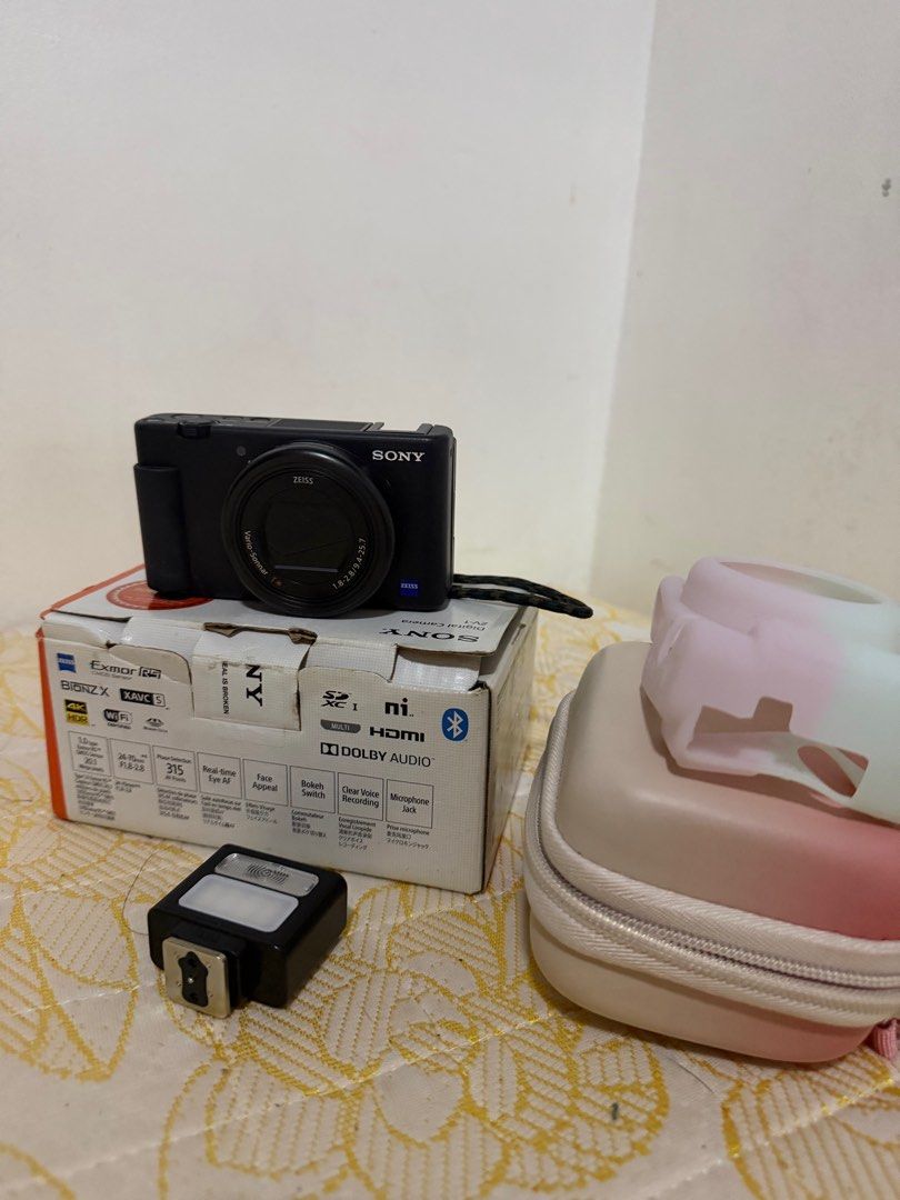 Sony ZV1 Compact Camera (Category: Cameras) located in Manila. Submitted by shoptilyoudrop12 (Listing ID 1401612864, Image 2). Description: Sony ZV1 Compact camera with freebies; camera bag, case and Ulanzi flash comes complete pristine condition.