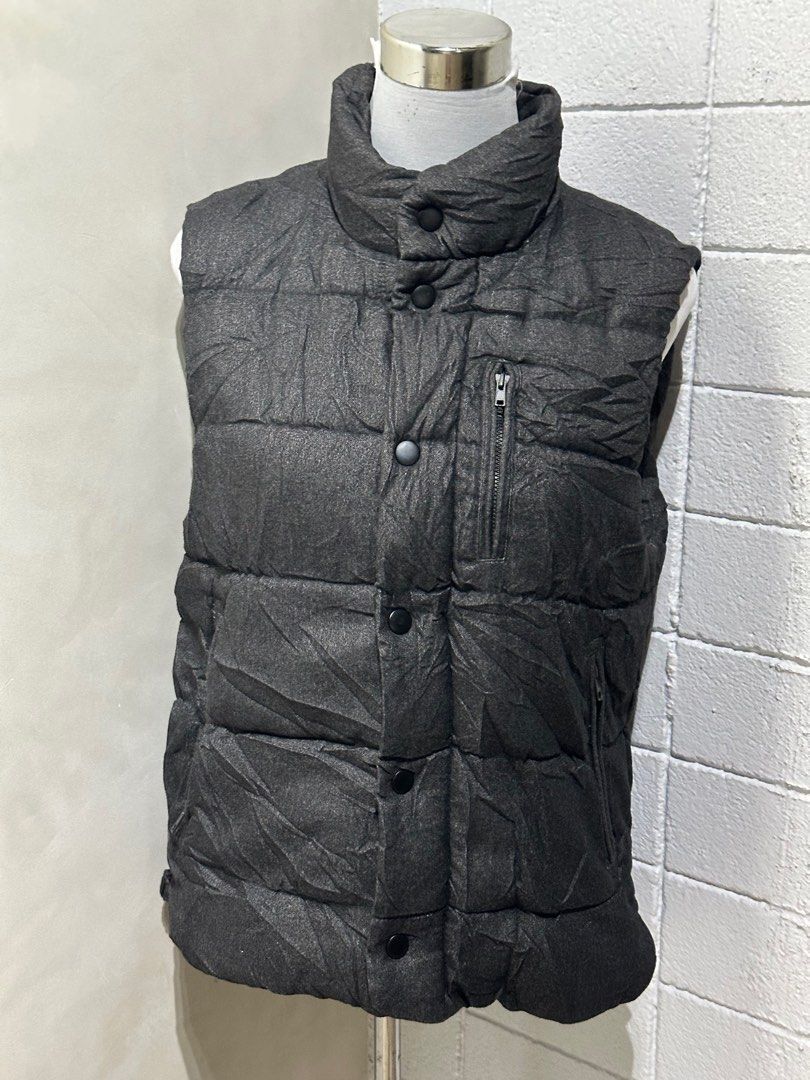 SPAO Padded Vest (Category: Vests) located in Tarlac. Submitted by wearagainboutique (Listing ID 1401656078, Image 2). Description: SALE SALE!!! Puffer Jackets/Vest * Any 2 For 1100 (price range of 600 and up) * Any 2 For 900 (price of 500) * Any 3 For 1000 (price range of 300 to 400) - SPAO padded vest - Dark grey color - Size: L - Quilted design - High collar - Zip closure - Button closure - Multiple pockets (some with zippers).