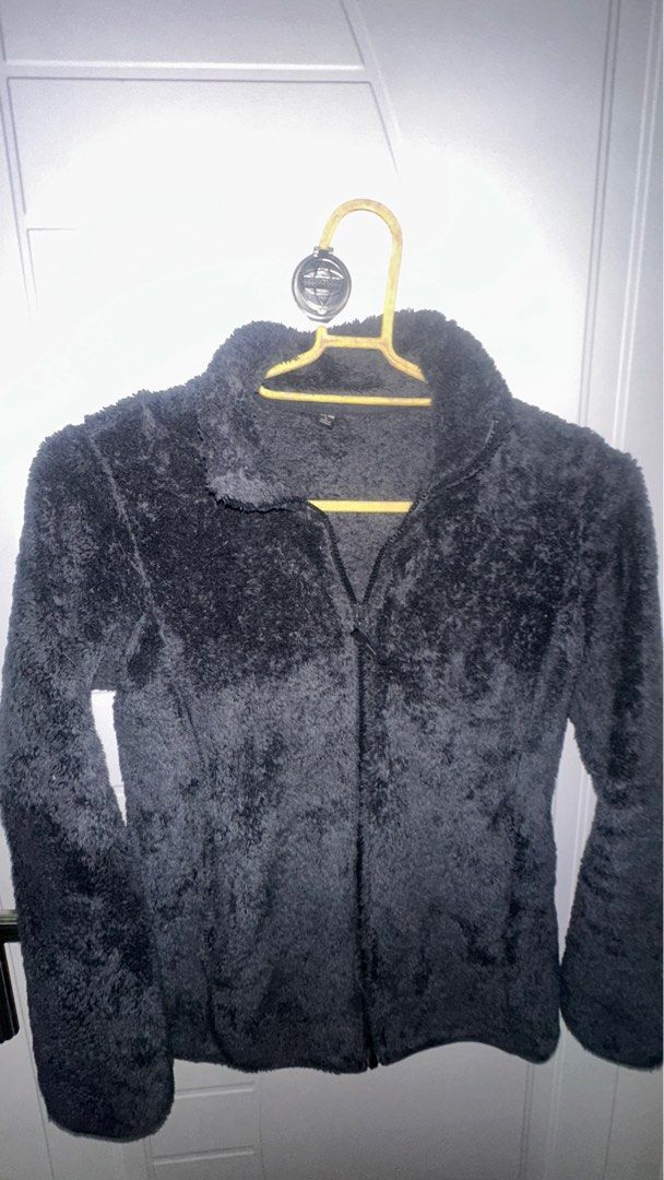 Uniqlo Fleece Jacket - Dark Grey - L (Category: Coats, Jackets and Outerwear) located in Manila. Submitted by omenagi (Listing ID 1401655540, Image 2). Description: - Uniqlo fleece jacket - Size: L (Can fit Medium well) - Color: Dark Grey - Features: Full zip, stand-up collar, 2 side pockets - Made in Vietnam - Perfect for layering.