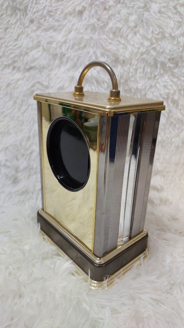 Vintage Gold and Glass Clock (Category: Clocks) located in Binan City. Submitted by sakuratreasuresph (Listing ID 1401638885, Image 3). Description: Vintage Queen Elizabeth II Commemorative Mantel Clock A finely crafted crystal mantel clock featuring a mirrored glass case, gold-tone frame, and rotating pendulum. A timeless piece of elegance, perfect for discerning collectors and those who appreciate refined home decor. 📏 Approx. Measurements: H 