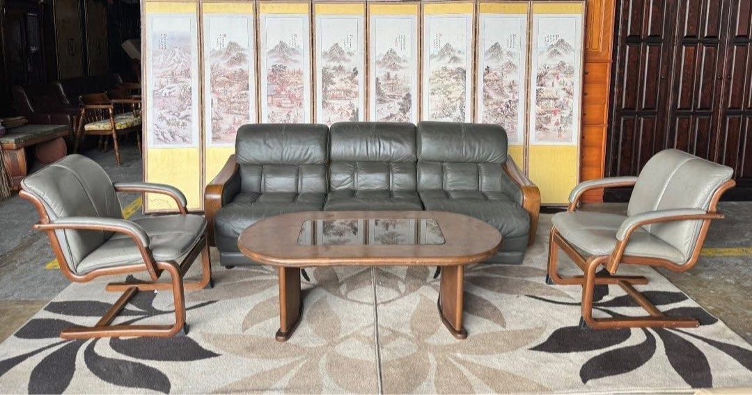 Vintage Leather Sofa Set (Category: Sofas) located in Angeles City. Submitted by maryannmar33098 (Listing ID 1401712658, Image 2). Description: Vintage sofa set includes a three-seater sofa, two armchairs, and a coffee table. The sofa and armchairs feature leather upholstery with wooden frames. The coffee table has a glass top. The set is placed on a patterned rug. This set is perfect for adding a touch of vintage charm to any living space..