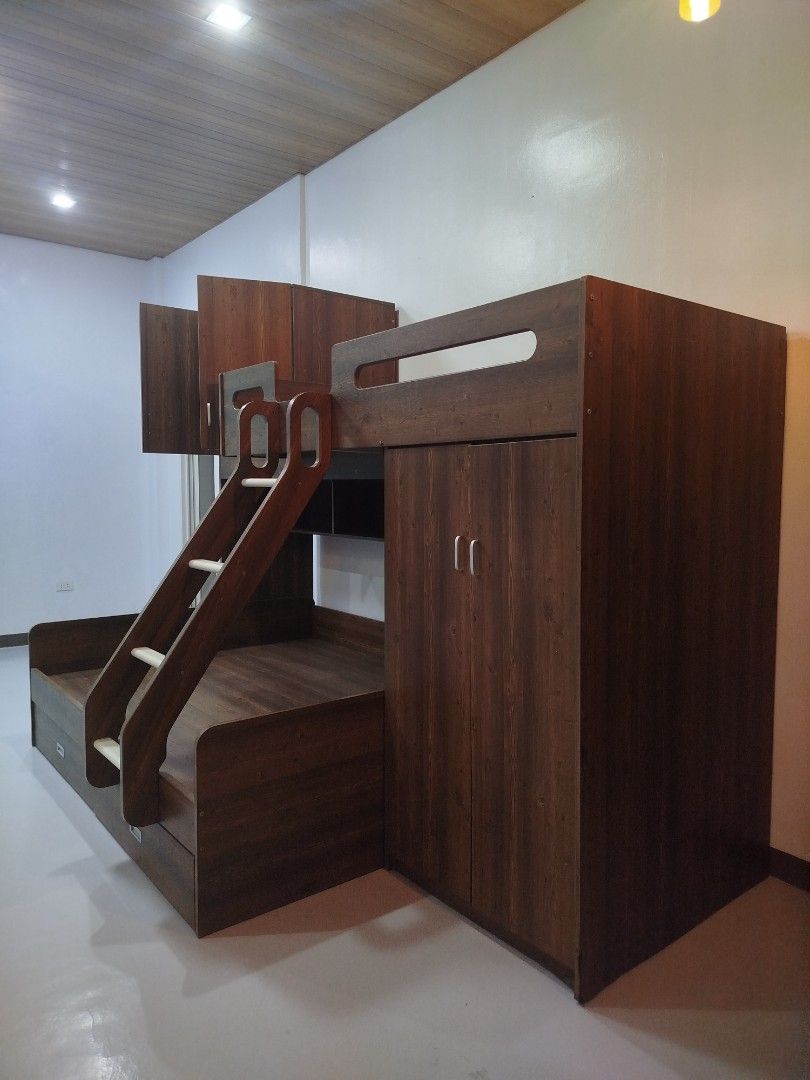 Wooden Bunk Bed with Storage and Ladder (Category: Bed Frames & Mattresses) located in Manila. Submitted by liz.clutters (Listing ID 1401675954, Image 2). Description: NEGOTIABLE!! READ ME original price is 30-35k - Wooden bunk bed - Built-in ladder - Storage cabinets and drawers - Top bunk with safety rails (Single Size Bed) - Lower bunk with drawers (Queen Size bed) - Warm wood vinyl finish - Includes multiple shelves - Space-saving design Issu
