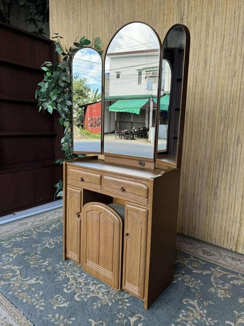 Wooden Vanity Table with Tri-Fold Mirror (Category: Tables & Sets) located in Manila. Submitted by eloizavill76462 (Listing ID 1401531466, Image 2). Description: Vanity Dresser Set L32/26.5 x W12 x H58.5/27 In good condition .