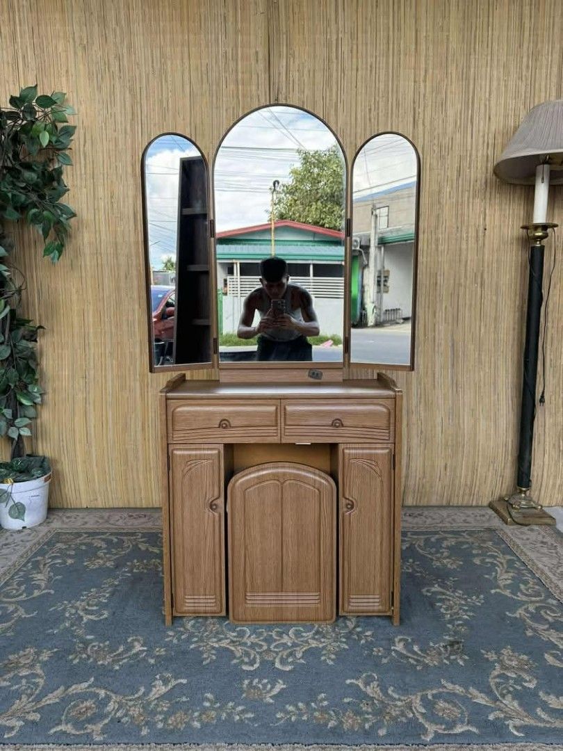 Wooden Vanity Table with Tri-Fold Mirror (Category: Tables & Sets) located in Manila. Submitted by eloizavill76462 (Listing ID 1401531466, Image 1). Description: Vanity Dresser Set L32/26.5 x W12 x H58.5/27 In good condition .