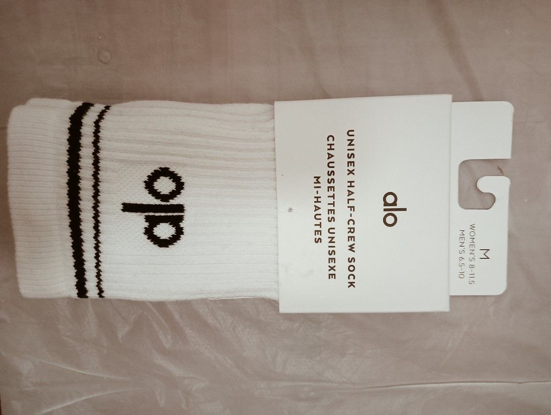 Alo Yoga Unisex Half-Crew Socks - White - Size M (Category: Socks) located in Singapore. Submitted by bookstand (Listing ID 1403388150, Image 2). Description: Brand new Alo Yoga unisex half-crew socks in white. Size M. Features the Alo logo and black stripes. Perfect for workouts or everyday wear. Comes with original packaging. Tag: alo socks, socks, unisex socks, Christmas, alo yoga, athleisure, Lululemon, sports socks, sports, decathlon, addida