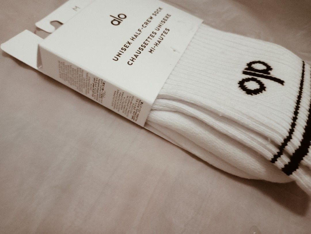 Alo Yoga Unisex Half-Crew Socks - White - Size M (Category: Socks) located in Singapore. Submitted by bookstand (Listing ID 1403388150, Image 1). Description: Brand new Alo Yoga unisex half-crew socks in white. Size M. Features the Alo logo and black stripes. Perfect for workouts or everyday wear. Comes with original packaging. Tag: alo socks, socks, unisex socks, Christmas, alo yoga, athleisure, Lululemon, sports socks, sports, decathlon, addida