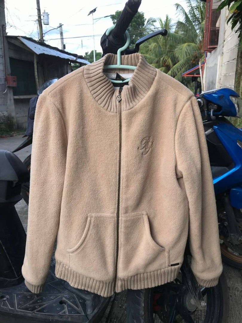 Baby Phat Fleece Jacket (Category: Coats, Jackets and Outerwear) located in Cotabato. Submitted by deneiljohn (Listing ID 1403348611, Image 1). Description: - Baby Phat fleece jacket - Neutral beige color - Size Large - Full zip closure - Two front pockets - Ribbed collar and cuffs - Embroidered Baby Phat logo on chest - Metal logo tag at hem - Lined with Baby Phat logo print.
