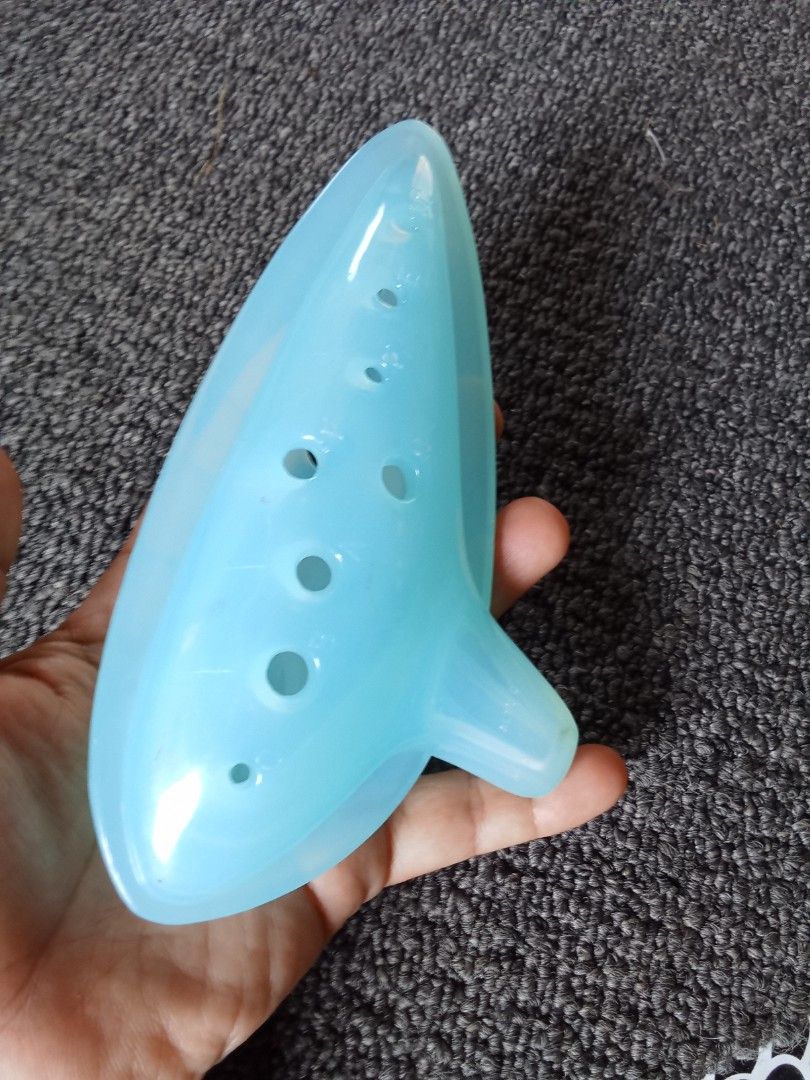 Blue Ocarina (Category: Musical Instruments) located in Bocaue. Submitted by marajapansurplus (Listing ID 1403252207, Image 3). Description: - Light blue ocarina - Made of durable plastic - Features a teardrop shape - Includes a mouthpiece - Perfect for beginners.