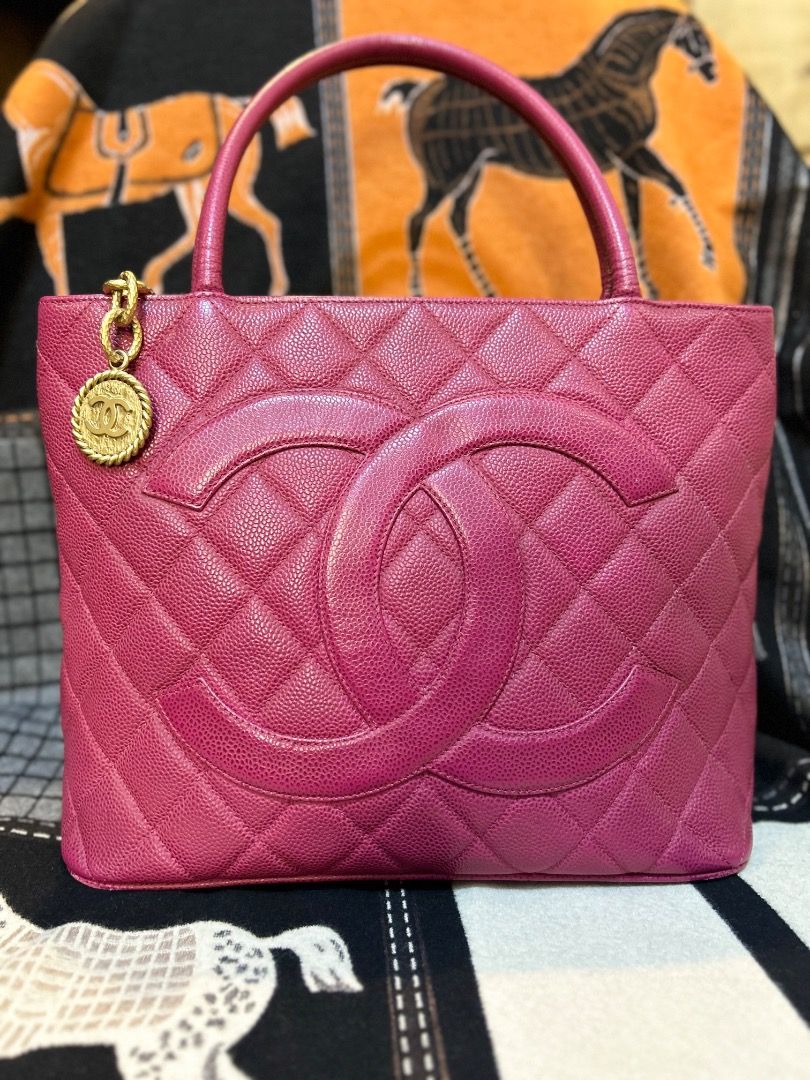 Chanel Medallion Tote Bag (Category: Luxury Bags & Wallets) located in Caloocan City. Submitted by piamariemo11606 (Listing ID 1403305706, Image 2). Description: - Authentic Chanel Medallion Tote - Vibrant pink color - Iconic CC logo - Gold-tone medallion charm - Quilted design - Top handle - Includes authenticity certificate - Pink interior.