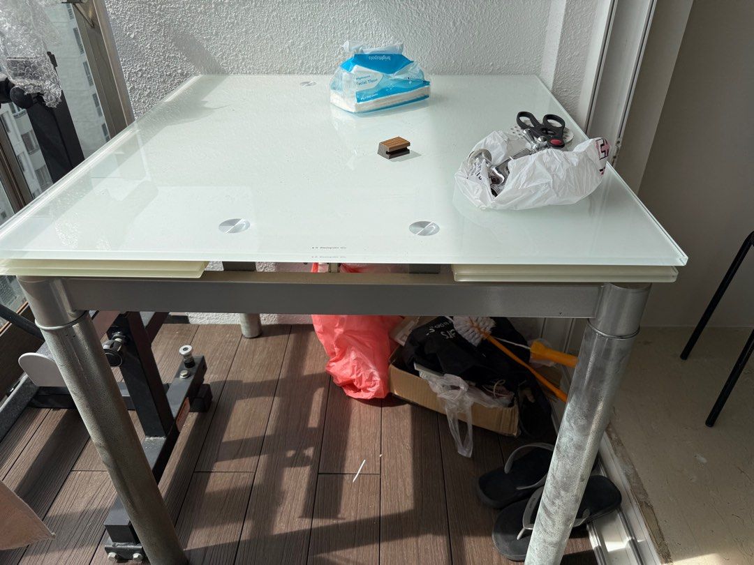 Dining Table Extendable (Category: Tables & Sets) located in Singapore. Submitted by davidbilly (Listing ID 1403257205, Image 2). Description: - Tempted glass top dining table - Metal legs - Suitable for small spaces - Non extend 80 CM and after fully extend 125 CM - Perfect for balcony or small dining area - Self-collection only .