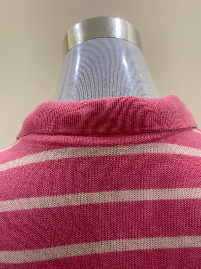 Faded Glory Pink Striped Polo Shirt (Category: Blouses) located in Cavite. Submitted by piawurtzface (Listing ID 1403389864, Image 2). Description: Pink and white striped polo shirt from Faded Glory. Features a collared neckline and short sleeves. The shirt has a button-up placket. Made of 96% cotton and 4% spandex. Size S/CH (4-6)..