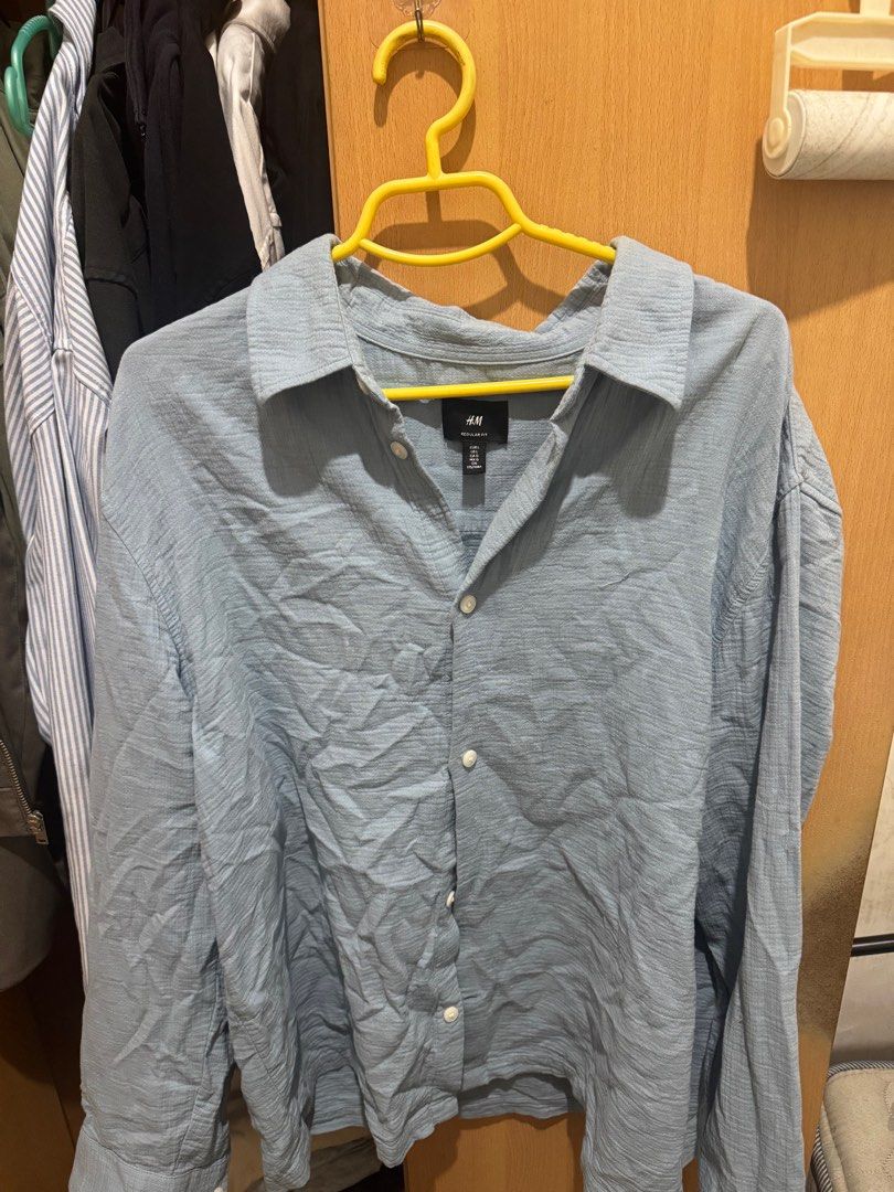 H&M Long Sleeve Shirt (Category: Tshirts & Polo Shirts ) located in Las Pinas. Submitted by jacobd124 (Listing ID 1403313714, Image 1). Description: - H&M light blue long linen textured sleeve shirt - Collared neckline - Button-down closure - Textured fabric - Regular fit - Perfect for casual wear or layering.
