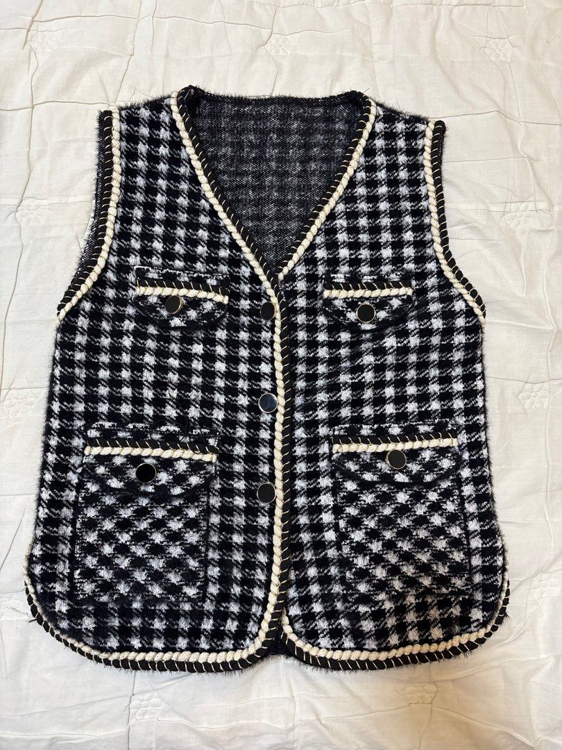 Houndstooth Vest with Pockets (Category: Vests) located in Taguig. Submitted by k4shh_ (Listing ID 1403402854, Image 1). Description: - Classic houndstooth vest - Black and white checkered pattern - V-neck design - Four functional pockets - Button-down closure - Cream-colored rope trim - Perfect for layering.