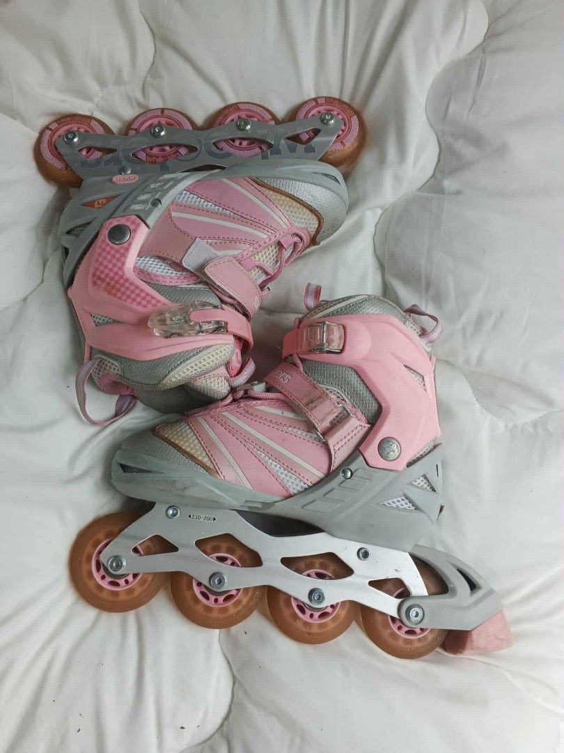 INLINE SKATE ADJUSTABLE SIZE (Category: Skates, Rollerblades & Scooters) located in Caloocan City. Submitted by youngdog_7a3ee7 (Listing ID 1403247811, Image 1). Description: - Wheelers inline skates - Pink and gray color scheme - Orange wheels - Secure buckle closure - Size indicated on inner tag.