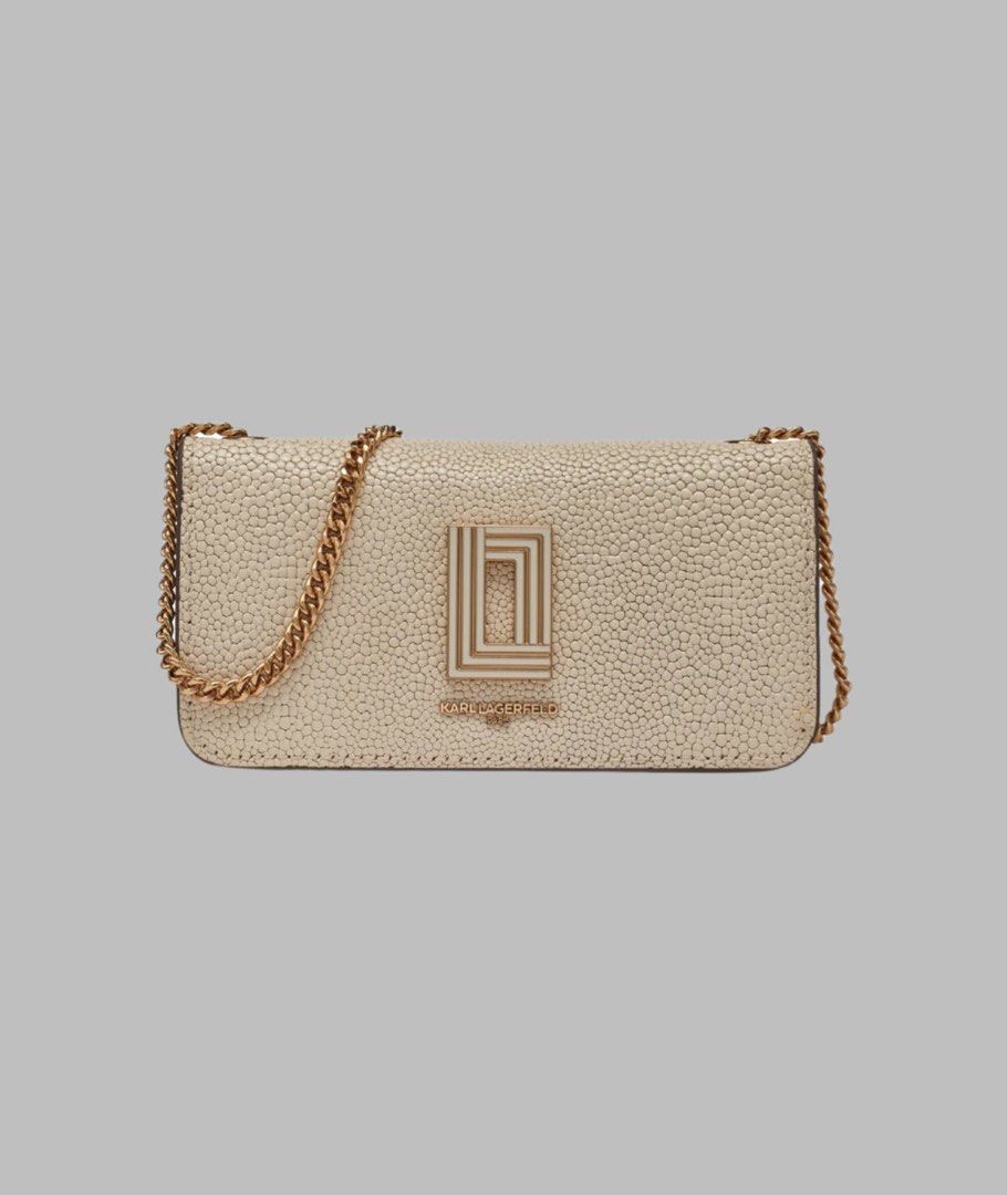 Karl Lagerfeld Chain Bag (Category: Luxury Bags & Wallets) located in Lapu Lapu. Submitted by Tinay (Listing ID 1403236945, Image 1). Description: - Karl Lagerfeld chain bag - Neutral color - Textured exterior - Gold-tone chain strap - Features Karl Lagerfeld logo - Flap closure - Compact size Shoulder bag measures approx. 5” H x 8” W x 4" D Shoulder strap measures approx. 21" L; Handle Drop measures approx. 6" L Shoulder bag Weighs approx. 1 Lb.