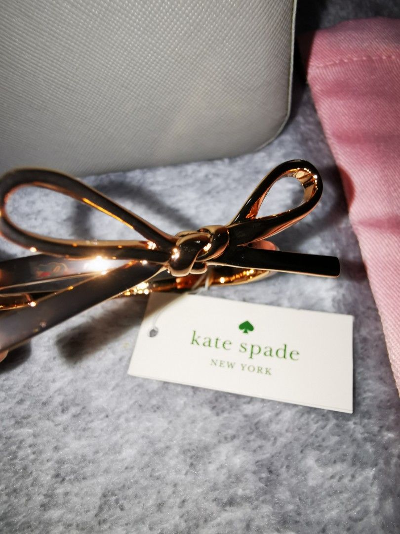 Kate Spade Bangle (Category: Bracelets) located in Pasig City. Submitted by puggable (Listing ID 1403414409, Image 1). Description: New / Kept Unused Kate Spade Bow Bangle in Rose Gold With KS Pink Pouch Guaranteed Authentic Bought from US **Decluttering**.