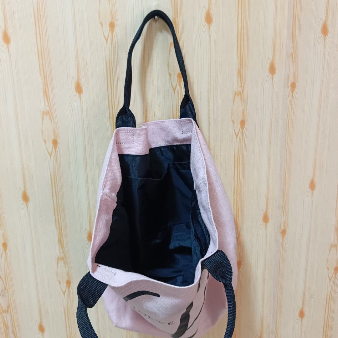 Loewe Pink Tote Bag (Category: Luxury Bags & Wallets) located in Manila. Submitted by almighthrift (Listing ID 1403272247, Image 2). Description: - Pink Loewe tote bag - Black handles - Canvas material - Everyday use.
