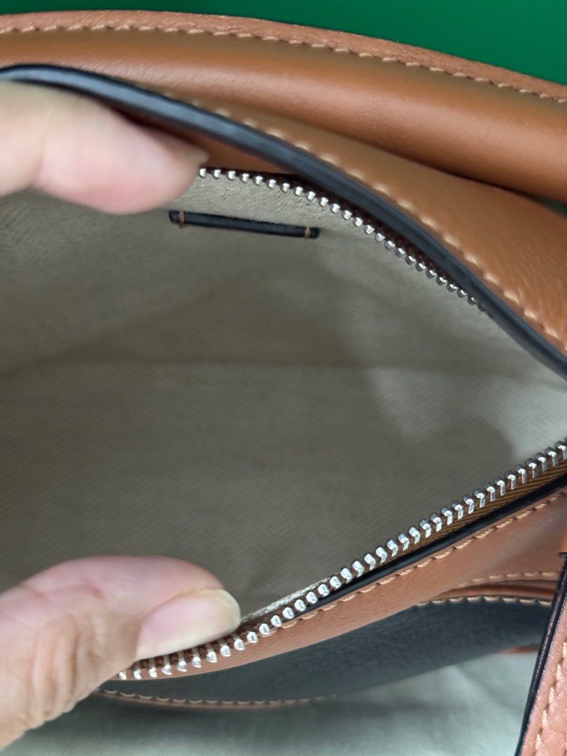 Loewe Puzzle Mini in Black-Tan (Category: Luxury Bags & Wallets) located in Quezon City. Submitted by voleremnl (Listing ID 1403358296, Image 2). Description: ❗️₱92K ❗️Loewe Puzzle Mini in Black-Tan UNUSED CONDITION; practically brand new, with only minor signs of prolonged storage Comes with dust bag, cards, and Entrupy authenticity certificate. Brand new price: 160-200K in Greenbelt This is the classic, OG Puzzle design! .