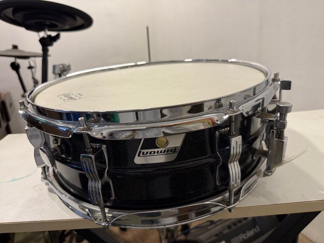 Ludwig Black Acrolite (Category: Musical Instruments) located in Manila. Submitted by aatal (Listing ID 1403232659, Image 1). Description: - Ludwig Black Acrolite snare drum. - Features a sleek black finish. - Known for its crisp and versatile sound. - In excellent condition. - A great choice for drummers of all levels..