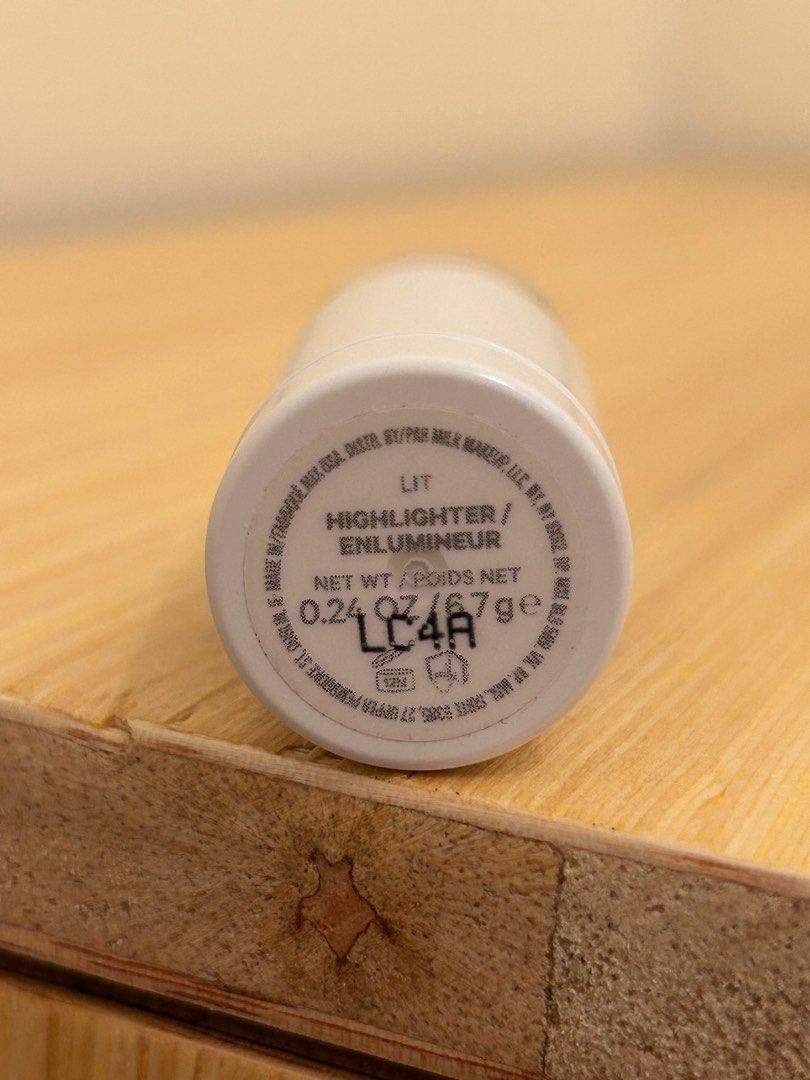 Milk Makeup Lit Highlighter (Category: Makeup) located in Mandaluyong City. Submitted by rfsneedfunds (Listing ID 1403343820, Image 2). Description: - Milk Makeup Lit Highlighter in 'Lit' shade - Creamy and buildable formula - Provides a natural glow - Product weight: 0.24 oz / 6.7g - Light bronze color - faulty screw:( use brush or scooper should you finish top contents already.