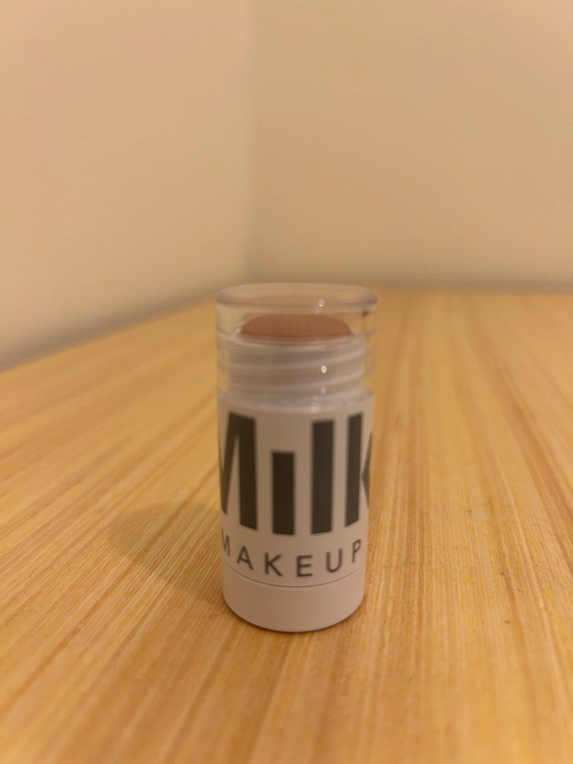 Milk Makeup Lit Highlighter (Category: Makeup) located in Mandaluyong City. Submitted by rfsneedfunds (Listing ID 1403343820, Image 1). Description: - Milk Makeup Lit Highlighter in 'Lit' shade - Creamy and buildable formula - Provides a natural glow - Product weight: 0.24 oz / 6.7g - Light bronze color - faulty screw:( use brush or scooper should you finish top contents already.