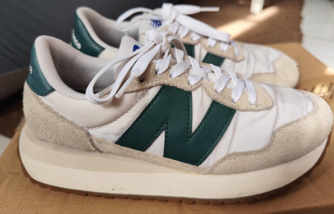 New Balance 237 Sneakers - White/Green (Category: Sneakers) located in Quezon City. Submitted by melsc (Listing ID 1403347329, Image 1). Description: PRELOVED New Balance 237 sneakers - White nylon upper - Green 'N' logo - Suede overlays - Off-white midsole - Brown outsole - New Balance logo on heel tab - Size indicated on inner tag SF shoulder by buyer Location: Quezon City Near SM North .