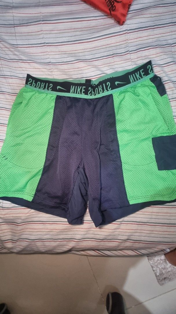 Nike Men's Reversible Training Shorts (Category: Shorts) located in Manila. Submitted by blizzardstan (Listing ID 1403275443, Image 3). Description: - Nike Large to XXL reversible shorts - Green and navy blue - Nike branded waistband - side pocket -Dei fit & Mesh material.