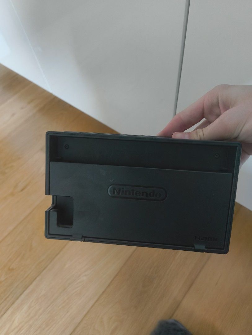 Nintendo Switch Dock and Controller (Category: Controllers) located in Manila. Submitted by lodburger (Listing ID 1403286853, Image 2). Description: - Nintendo Switch dock included (black, Nintendo logo). - Controller included (black and red, unique design) - Enhance your gaming experience!.