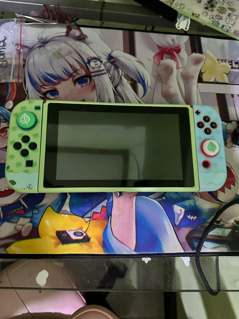 Nintendo Switch One (Category: Nintendo) located in Manila. Submitted by numee (Listing ID 1403343451, Image 1). Description: - With custom green and blue Joy-Con thumb covers - Black screen console - Free Animal Crossing themed protective case - Well-used but well taken care of - With plenty of game inclusions (Animal Crossing, Pokemon games, and more) Selling my well-loved switch :(, for the switch alone, will be selling for 18k negotiable, but