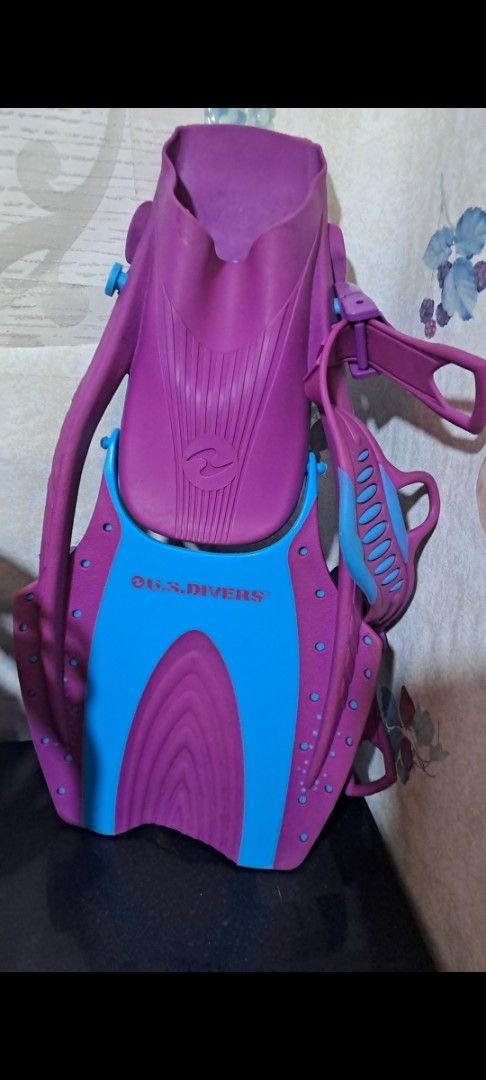 Ocean Divers Fins XL (Category: Water Sports) located in Davao. Submitted by bravemoon_556cd5 (Listing ID 1403267555, Image 2). Description: Ocean Divers fins in purple and blue. Includes a snorkel. Size XL, fits shoe sizes 38-39. Features a unique design for efficient swimming. The fins have adjustable straps for a secure fit. The snorkel is also included. Ready for your next underwater adventure!.