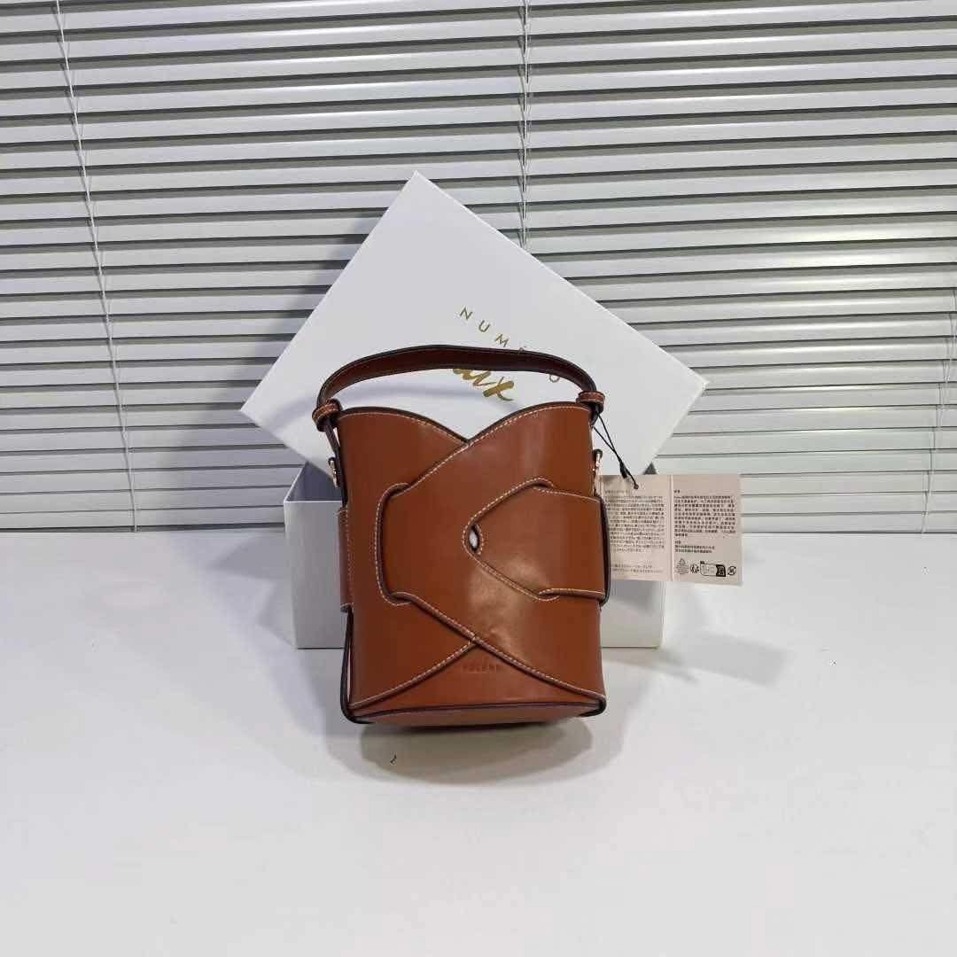 Polène Numero Dix Bucket Bag (Category: Luxury Bags & Wallets) located in Manila. Submitted by chichays_closet (Listing ID 1403416347, Image 2). Description: - Polène Numero Dix bucket bag - Available Colors: Tan, Black, Light Blue, Beige - Includes original box and tags - Unique bucket bag design - Top handle and detachable shoulder strap - Structured shape.