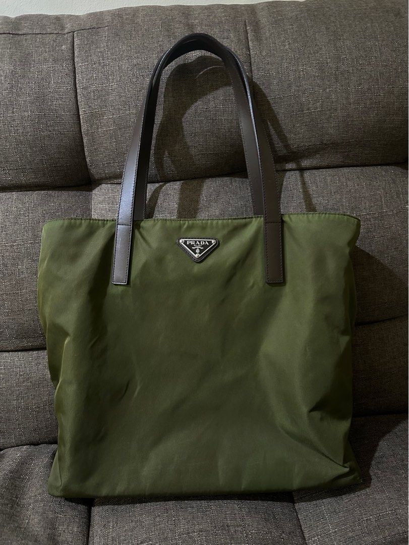 Authentic Prada Nylon Tote Bag (Category: Luxury Bags & Wallets) located in Los Banos. Submitted by bianxster (Listing ID 1403022235, Image 1). Description: - Authentic Prada tote bag - Green nylon material - Brown leather handles - Perfect pangharabas/everyday bag:) - Inclusion: cards and generic dust bag - Has normal wear (some glazing in the handles) though barely noticeable, and still in very good condition - if you’re maselan, this bag is no