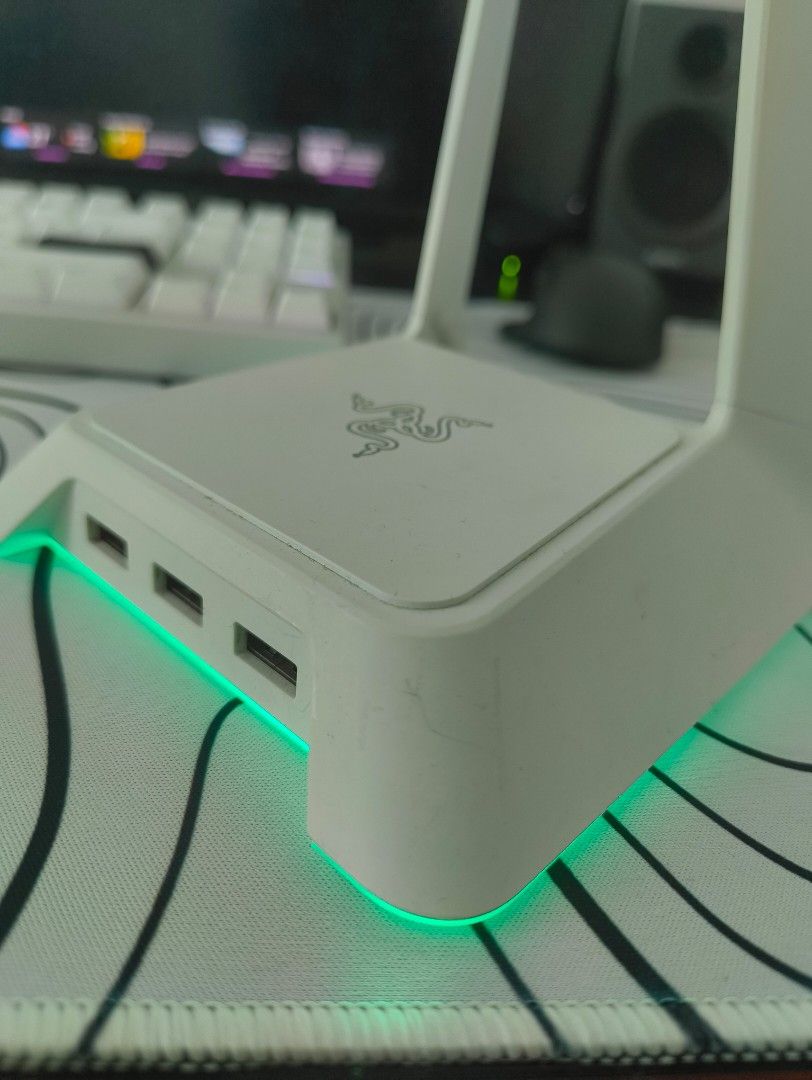 Razer Chroma Headphone Stand (Category: Headphones & Headsets) located in Manila. Submitted by lodburger (Listing ID 1403283307, Image 3). Description: Razer Chroma headphone stand features a sleek white design with built-in USB ports. It has a glowing LED base that adds a cool aesthetic to your setup. The stand is designed to hold your headphones securely and keep your desk organized. It also has the Razer logo on the top..