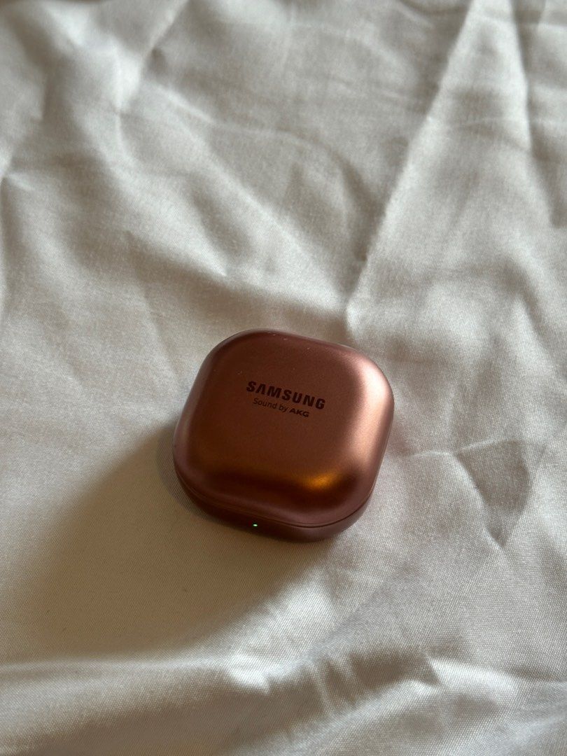 Samsung Galaxy Buds Pro (Category: Earphones) located in Manila. Submitted by pck_____ (Listing ID 1403306631, Image 2). Description: - Samsung Galaxy Buds Pro (rosegold color) - Case features "Samsung Sound by AKG" - Product information printed on the case.