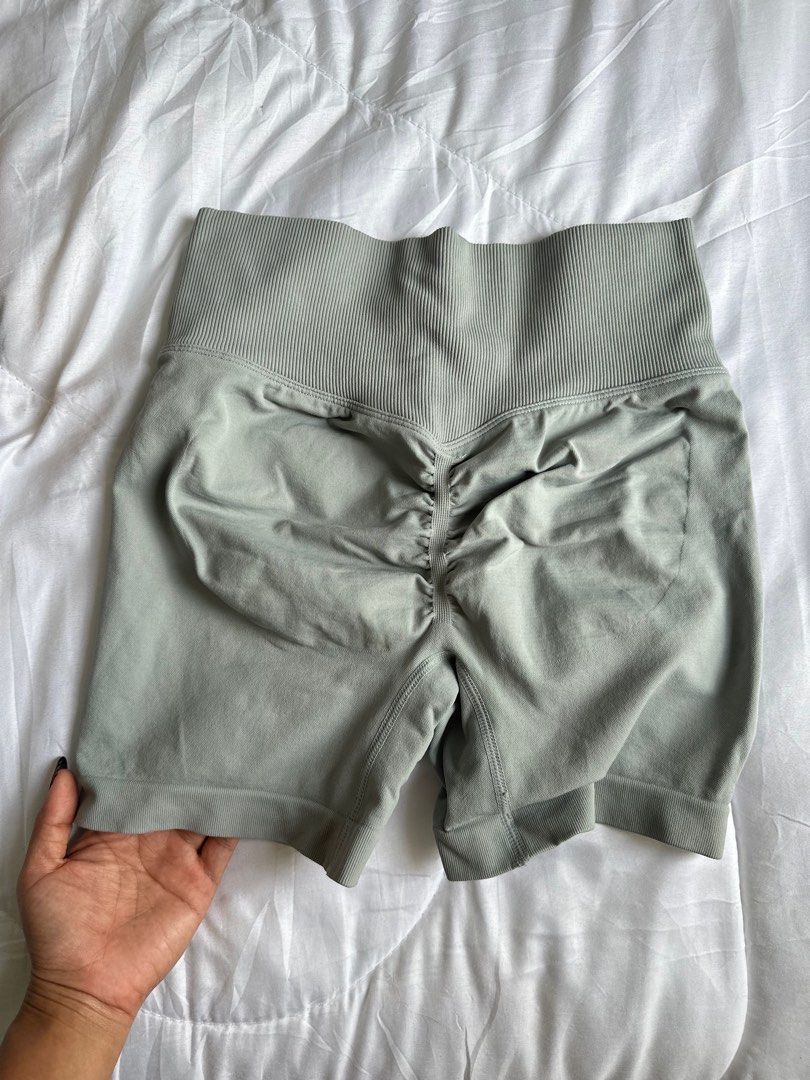 Seamless Ruched Shorts - Size S (Category: Shorts) located in Santa Rosa. Submitted by declutterbydl (Listing ID 1403347041, Image 2). Description: - Seamless shorts - Ruched back design - High-waisted ribbed waistband - Size: S - Color: Light green/grey - Material: 90% nylon, 10% spandex.