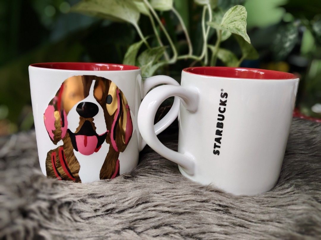 Starbucks Dog Mug (Category: Coffee & Tea Tableware) located in Quezon City. Submitted by anna.anna8 (Listing ID 1403358330, Image 3). Description: - Starbucks mug with a cute dog design. - Features a vibrant red interior with a paw print. - Comfortable handle for easy grip. - Ideal for coffee and tea lovers. - A great addition to your mug collection - new.