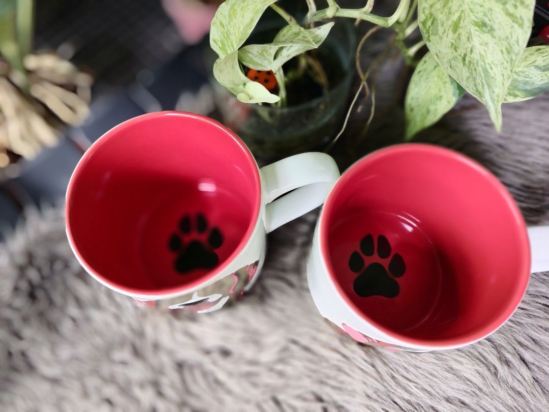 Starbucks Dog Mug (Category: Coffee & Tea Tableware) located in Quezon City. Submitted by anna.anna8 (Listing ID 1403358330, Image 2). Description: - Starbucks mug with a cute dog design. - Features a vibrant red interior with a paw print. - Comfortable handle for easy grip. - Ideal for coffee and tea lovers. - A great addition to your mug collection - new.