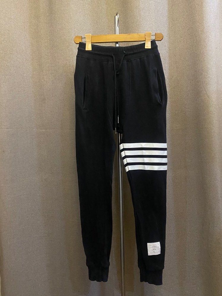 Thom Browne Black Sweatpants with White Stripes (Category: Joggers) located in Angeles City. Submitted by hunymoons (Listing ID 1403355121, Image 1). Description: Tom browne Jogger 25 laid flat to 30 waist, 36.5 length ₱700.
