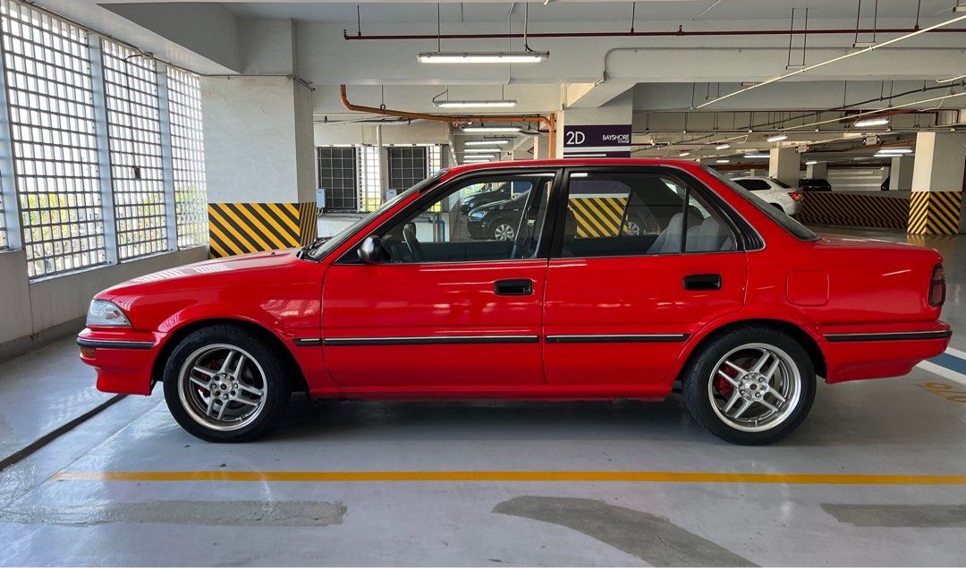 Toyota Corolla AE92 Manual (Category: Used Cars) located in Quezon City. Submitted by ranchuguy (Listing ID 1403245521, Image 3). Description: Fully Restored 1990 Toyota Corolla 1.6 GL (PHDM Setup) MESSAGE ME FOR COMPLETE SPECS AND MORE PHOTOS. • OEM+ build • 153k km • Manual • Red repaint – collector-owned • Engine overhauled to factory specs • Working TVSV, AAP valve & carb sensor • Perfect idle-up & cold start • K&N filter, TRD high-tension wi
