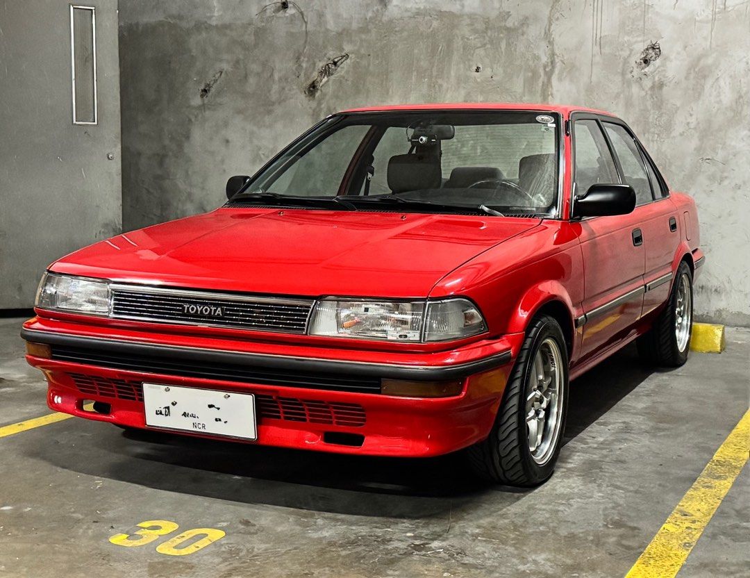 Toyota Corolla AE92 Manual (Category: Used Cars) located in Quezon City. Submitted by ranchuguy (Listing ID 1403245521, Image 1). Description: Fully Restored 1990 Toyota Corolla 1.6 GL (PHDM Setup) MESSAGE ME FOR COMPLETE SPECS AND MORE PHOTOS. • OEM+ build • 153k km • Manual • Red repaint – collector-owned • Engine overhauled to factory specs • Working TVSV, AAP valve & carb sensor • Perfect idle-up & cold start • K&N filter, TRD high-tension wi