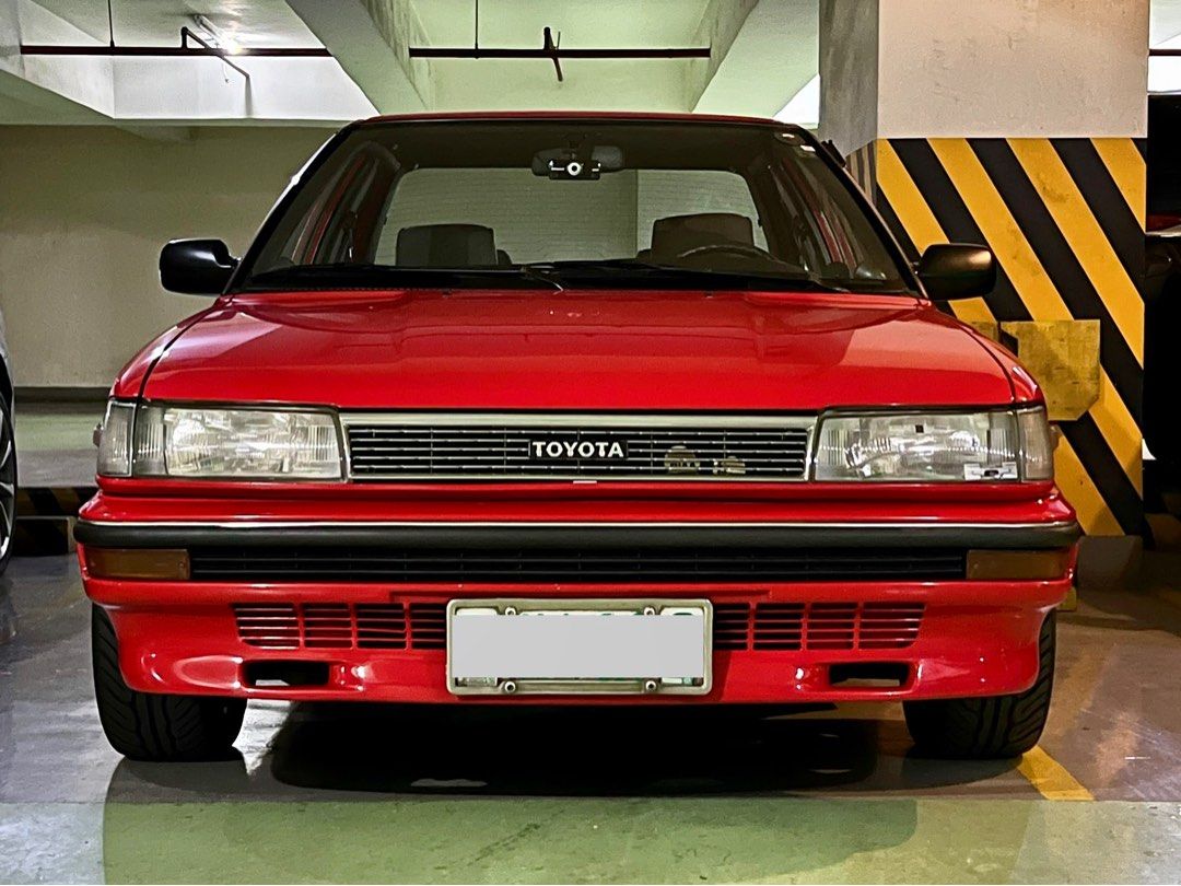 Toyota Corolla AE92 Manual (Category: Used Cars) located in Quezon City. Submitted by ranchuguy (Listing ID 1403245521, Image 2). Description: Fully Restored 1990 Toyota Corolla 1.6 GL (PHDM Setup) MESSAGE ME FOR COMPLETE SPECS AND MORE PHOTOS. • OEM+ build • 153k km • Manual • Red repaint – collector-owned • Engine overhauled to factory specs • Working TVSV, AAP valve & carb sensor • Perfect idle-up & cold start • K&N filter, TRD high-tension wi